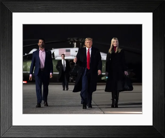 Framed Print : President Donald Trump, with his adult children, Ivanka and Donald Trump Jr. returning from campaigning for Republican Senate candidates in Georgia, Jan