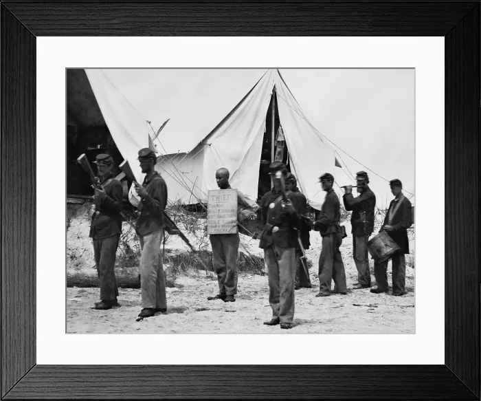 Framed Print : US Civil War, July-August 1863. A Morris Island, South Carolina, soldier wears a sign reading, This Man, Benj. T. Ditcher, 55th Mass. Vol. Stole Money from a wounded friend