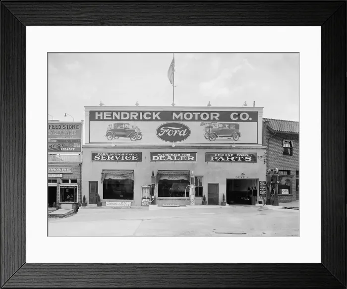 Framed Print : Hendrick Motor Co. in Washington, D.C. in the 1920s. They advertise as an authorized Ford dealer, that provides authorized Ford service, and genuine Ford parts (BSLOC_2016_10_114)