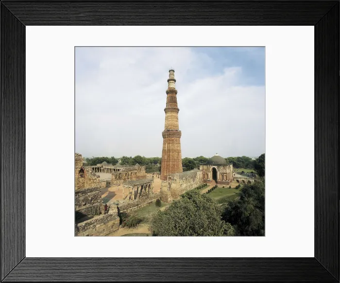 Framed Print : Quwwat Al-Islam Mosque. 1190s. INDIA. DELHI. Delhi. Quwwat Al-Islam Mosque and its minaret Qutub Minar. Islamic art. Architecture. AISA / Everett Collection**US SALES ONLY**