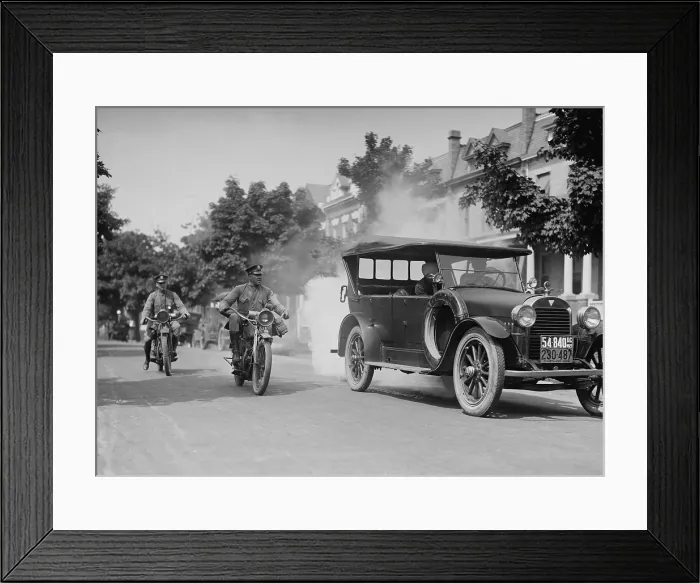 Framed Print : Police on motorcycles trailing a car with heavy smoke exhaust, Washington, D.C. Sept. 1, 1923 (BSLOC_2016_10_126)