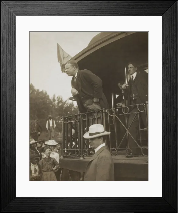 Framed Print : President Theodore Roosevelt speaking to an audience which includes several African Americans. TR leans over the back of a railroad car in 1907 to emphasize important statement Framed Print : President Theodore Roosevelt speaking to an audience which includes several African Americans. TR leans over the back of a railroad car in 1907 to emphasize important statement