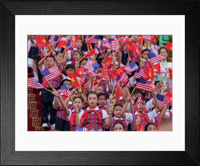 Framed Print : Vietnamese children at the Central Office of the Communist Party of Vietnam, wave American and Vietnamese flags for US President Joe Biden, Sept. 10, 2023. (BSLOC_2023_8_57)