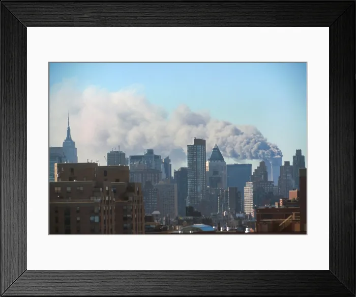 Framed Print : Smoke billowing from the Twin Towers following September 11th terrorist attack on World Trade Center