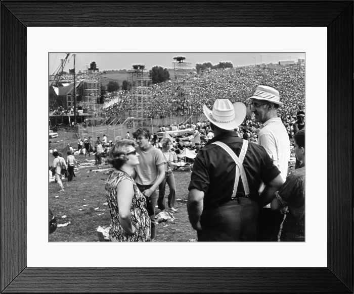 Framed Print : WOODSTOCK, farmer Max Yasgur (right) looks on with neighbors as his grounds are used as site for Woodstock Festival, 1970