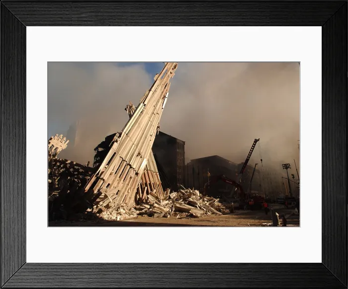 Framed Print : Debris from the WTC 2, the South Tower along Church St. on Sept. 13, 2001. The black buildings in the background are WTC 4 and WTC 5
