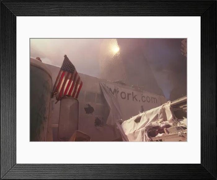 Framed Print : American flag planted in the rubble of World Trade Center after 9-11 terrorist attacks Framed Print : American flag planted in the rubble of World Trade Center after 9-11 terrorist attacks