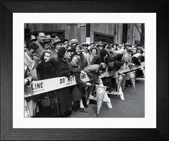 Framed Print : Spectators lean over barricades to watch the approaching St. Patrick's Day Parade in NYC, 1951 (BSLOC_2018_1_65)