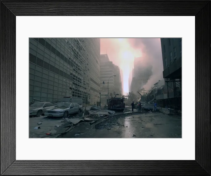 Framed Print : The wreckage of WTC 7, the newest building in the complex which collapsed at 5:20 PM on 9-11. Photo was taken on Barclay Street, looking east toward West Broadway