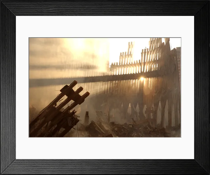 Framed Print : Sun streams through the dust over the wreckage of the World Trade Center. New York City, Sept. 15, 2001. (BSLOC_2015_2_83)