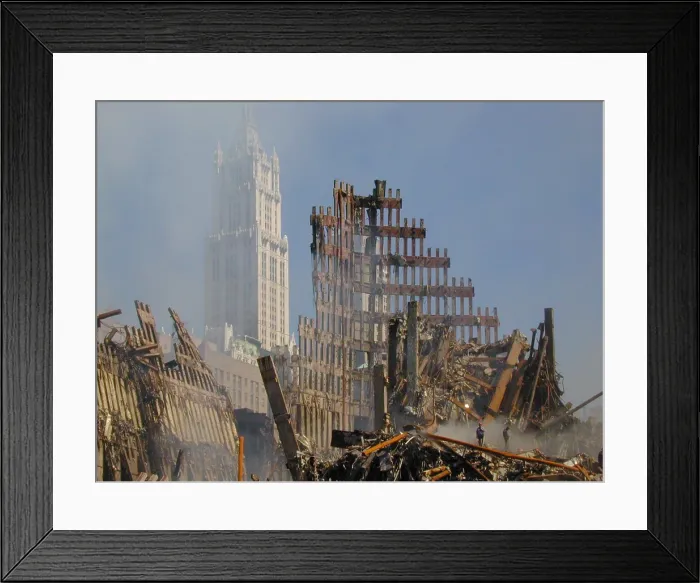 Framed Print : Woolworth Building rises behind the rubble of the collapsed North Tower of the WTC, Sept. 16, 2001. World Trade Center, New York City, after September 11, 2001 terrorist attacks