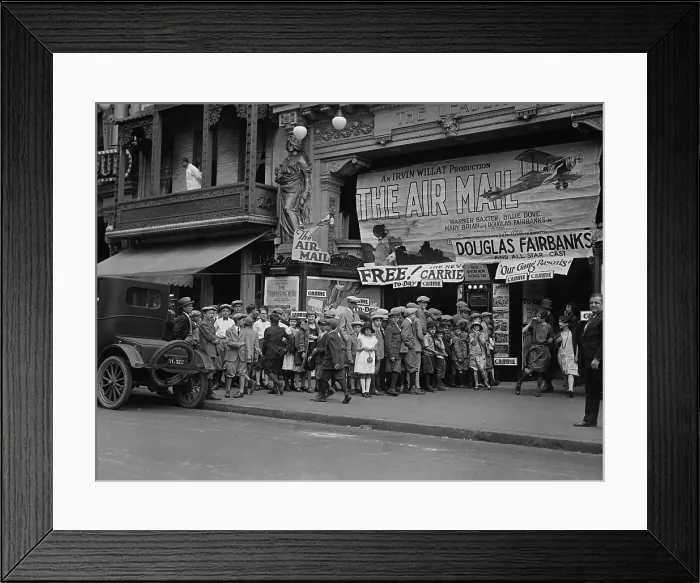 Framed Print : Ticket holders wait in front of The Leader movie theater in Washington, D.C. 1925. The day's feature was THE AIR MAIL starring Douglas Fairbanks