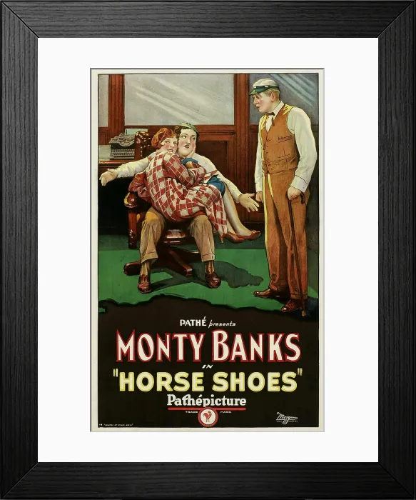 Framed Print : HORSE SHOES, woman curled up on lap: Jean Arthur; man with arms outstretched, seated: Monty Banks, 1927