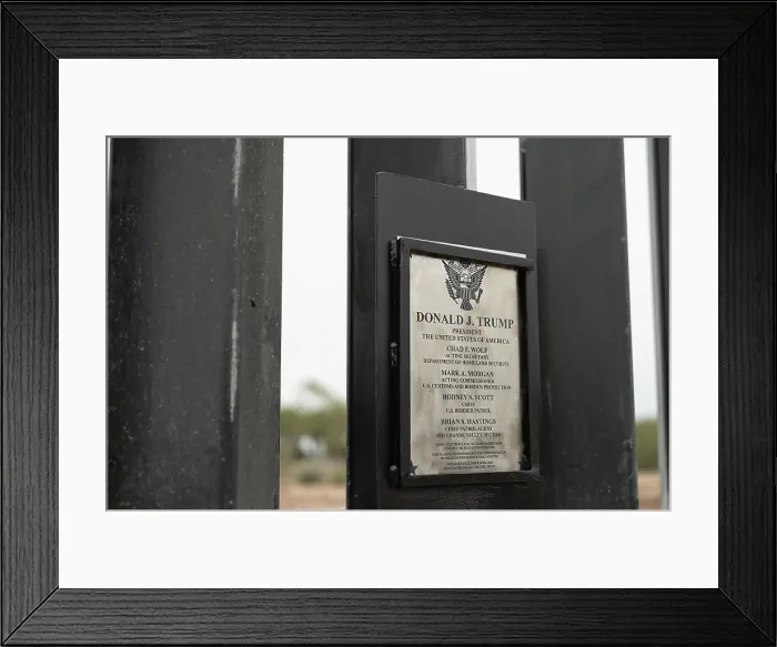 Framed Print : Plaque commemorates the construction of a human barrier wall on the US Mexican Border, Jan. 12, 2021