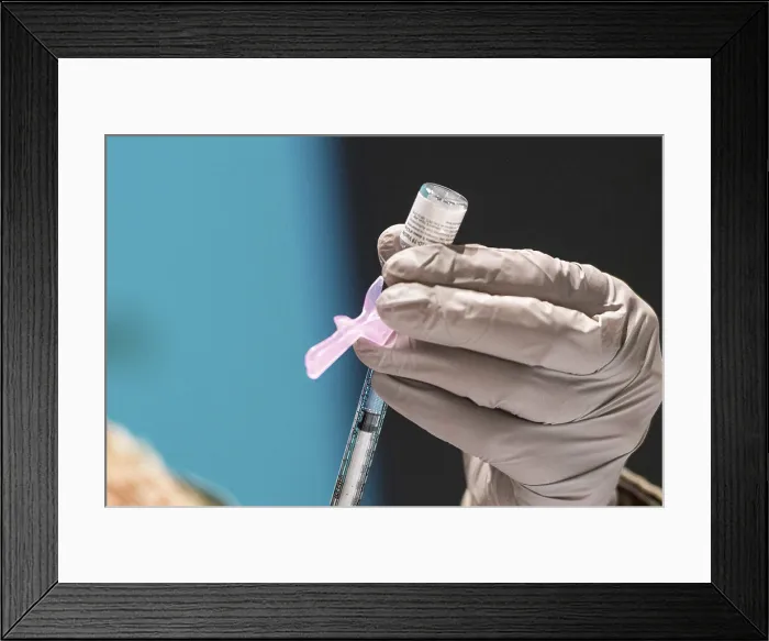 Framed Print : A technician loads a syringe with the Pfizer-BioNTech COVID-19 vaccine at Wright-Patterson Air Force Base, Ohio, Jan. 5, 2021 (BSLOC_2021_1_25)