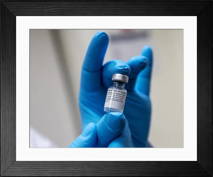 Framed Print : Pfizer-BioNTech COVID-19 vaccine vial is held by medical personal at Walter Reed National Military Medical Center, Bethesda, Md. Dec. 14, 2020 (BSLOC_2021_1_23) Framed Print : Pfizer-BioNTech COVID-19 vaccine vial is held by medical personal at Walter Reed National Military Medical Center, Bethesda, Md. Dec. 14, 2020 (BSLOC_2021_1_23)