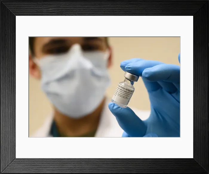Framed Print : Pfizer-BioNTech COVID-19 vaccine vial is held by masked medical personal at Walter Reed National Military Medical Center, Bethesda, Md. Dec. 14, 2020 (BSLOC_2021_1_24) Framed Print : Pfizer-BioNTech COVID-19 vaccine vial is held by masked medical personal at Walter Reed National Military Medical Center, Bethesda, Md. Dec. 14, 2020 (BSLOC_2021_1_24)