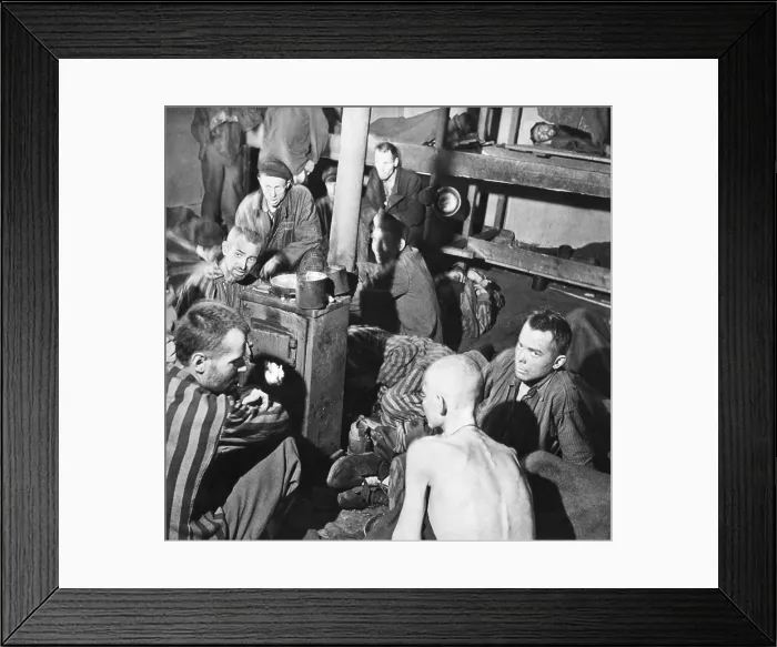 Framed Print : Sandbostel Prison camp survivors sit around a stove fire after British Liberation, April 30, 1945 Framed Print : Sandbostel Prison camp survivors sit around a stove fire after British Liberation, April 30, 1945