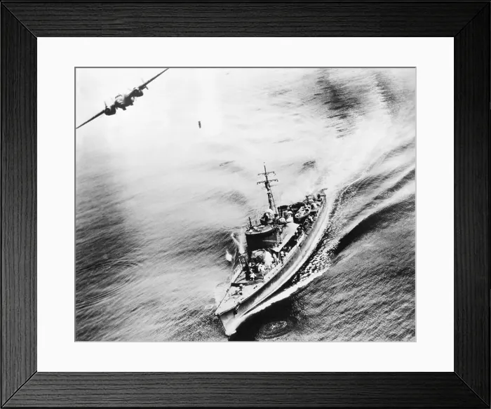Framed Print : Small Japanese war vessel bombed by U.S. B-25 bomber in the Bismarck Sea, March 21, 1944. The ships crew can be seen running for cover