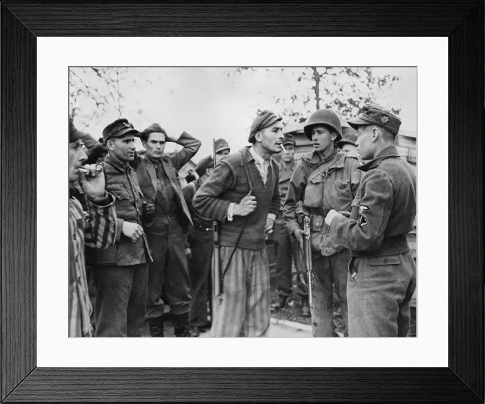 Framed Print : Freed Polish prisoner (center) of Dachau confronts a Nazi SS trooper for mistreatment of inmates
