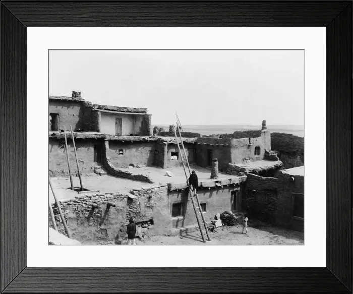 Framed Print : A CORNER OF ZUNI, by Edward S. Curtis, 1903. The photo shows three Zuni Indians in the multistoried, terraced, adobe building attached homes