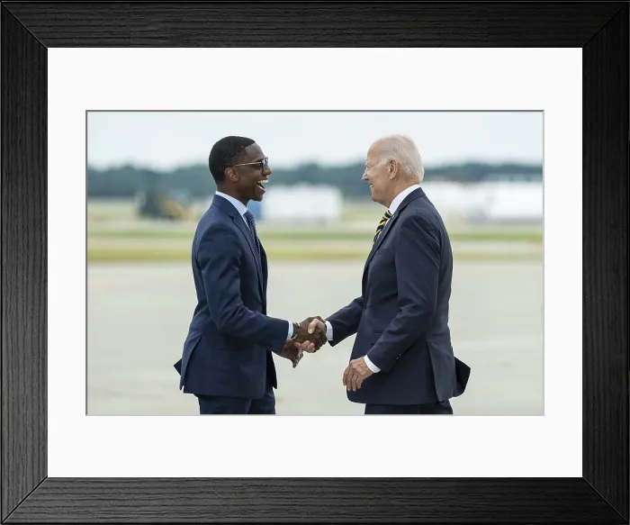 Framed Print : President Joe Biden is greeted by Mayor Justin Bibb as he arrives at Cleveland, Ohio, July 6, 2022