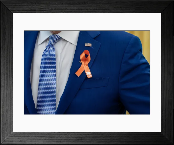 Framed Print : President Joe Biden, wears an orange ribbon for gun violence awareness. The color was chosen in memory of 15-year-old, Hadiya Pendleton, whose favorite color was orange
