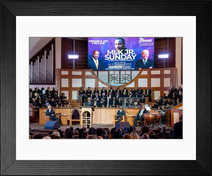 Framed Print : President Joe Biden listens as Sen. Raphael Warnock, the head pastor of Ebenezer Baptist Church speaks in the New Horizon Sanctuary, Jan. 15, 2023