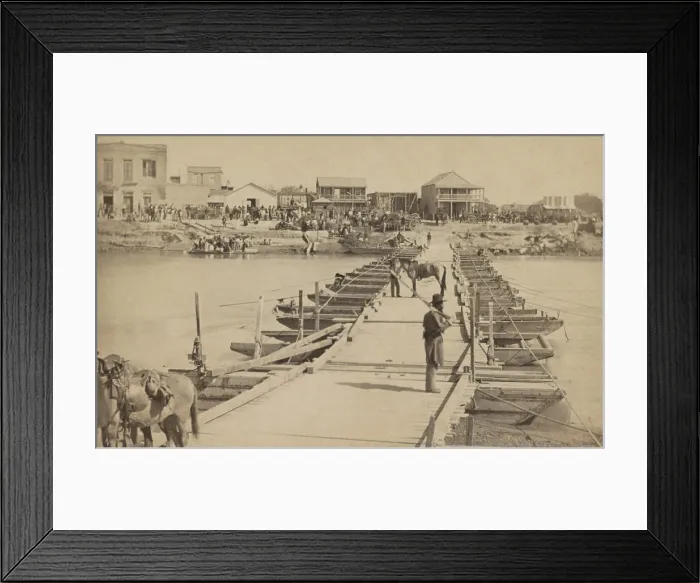 Framed Print : Levee Street in Brownsville, Texas, viewed from the US Army pontoon bridge across the Rio Grande River at Matamoros, Mexico, in November of 1866