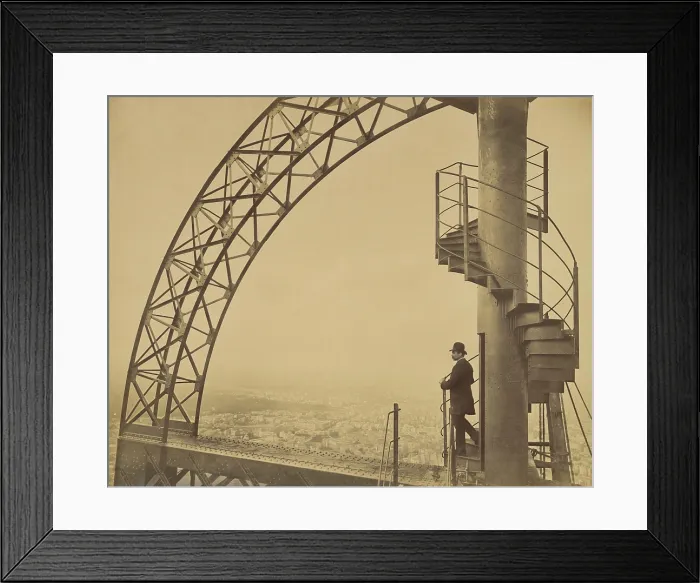 Framed Print : Man standing on the scientific tower of the Eiffel Tower in 1889