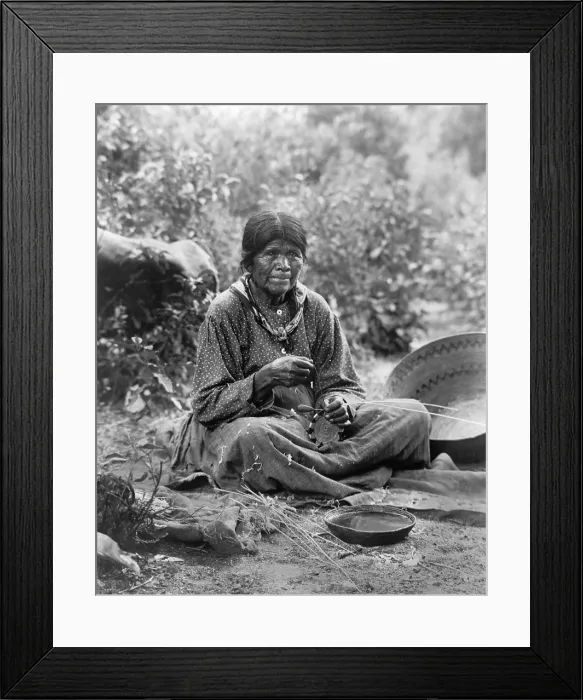 Framed Print : A Paiute woman weaves a basket. In their Great Basic semi-arid environment, Paiute were a nomadic people who made versatile baskets from plant fiber Framed Print : A Paiute woman weaves a basket. In their Great Basic semi-arid environment, Paiute were a nomadic people who made versatile baskets from plant fiber