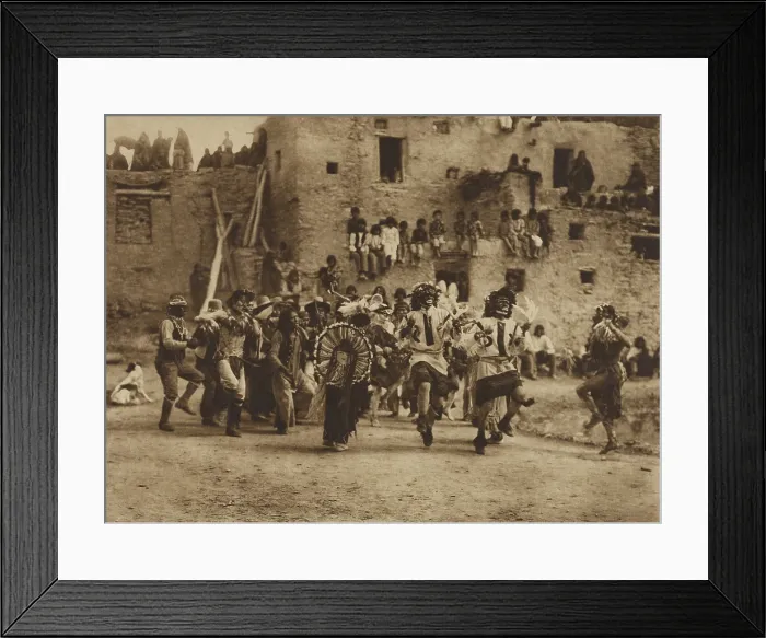 Framed Print : BUFFALO DANCE AT HANO, 1921, by Edward S. Curtis. Spectators positioned on the rooftops view of ceremonial dance in the pueblo courtyard
