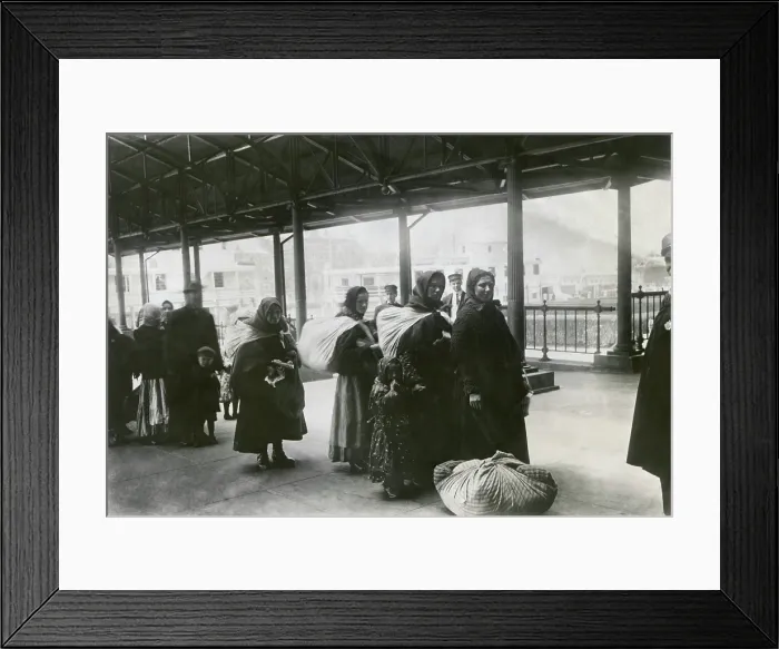 Framed Print : After receiving their admission papers, European immigrants line up leave Ellis Island, 1900