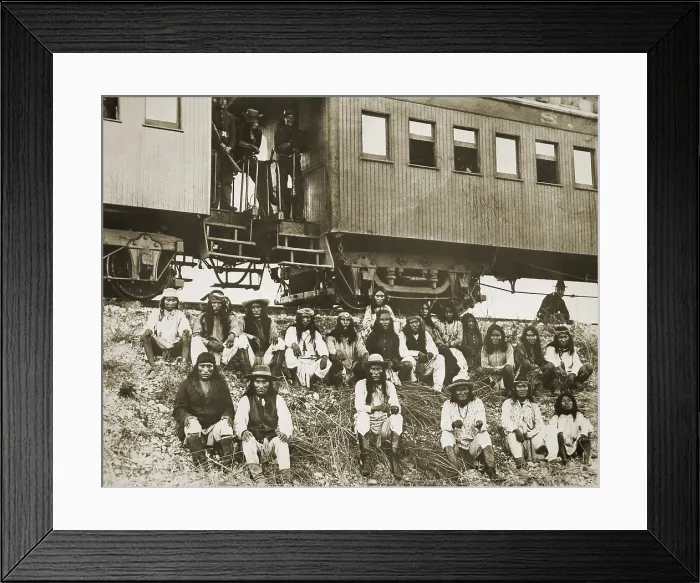 Framed Print : Chiricahua Apache prisoners, including Geronimo (1st row, 3rd from right), sit on an embankment outside a railroad car in Arizona Framed Print : Chiricahua Apache prisoners, including Geronimo (1st row, 3rd from right), sit on an embankment outside a railroad car in Arizona