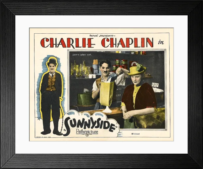 Framed Print : SUNNYSIDE, on left border: Charles Chaplin (aka Charlie Chaplin'); in scene on right: Charles Chaplin (man on left)