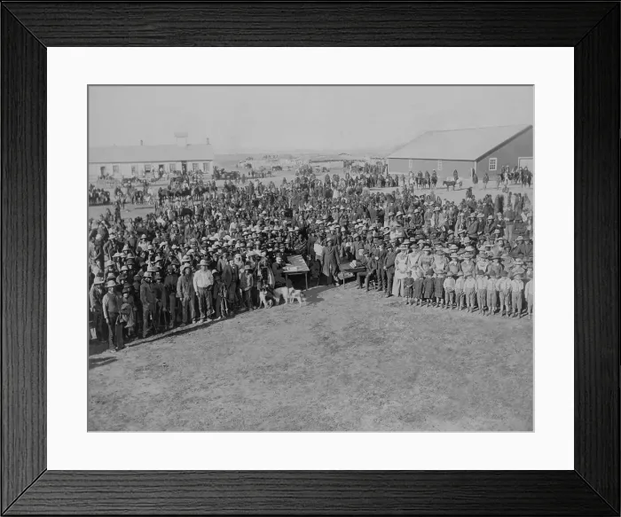 Framed Print : Euro-American census takers sit at two tables in front of a large crowd of Native Americans at Standing Rock Agency, South Dakota, ca. 1880-1900