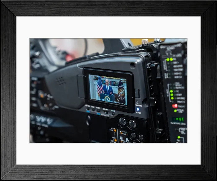 Framed Print : President Joe Biden is seen on small screen of a digital motion camera he announces his request to Congress for additional funding for arms