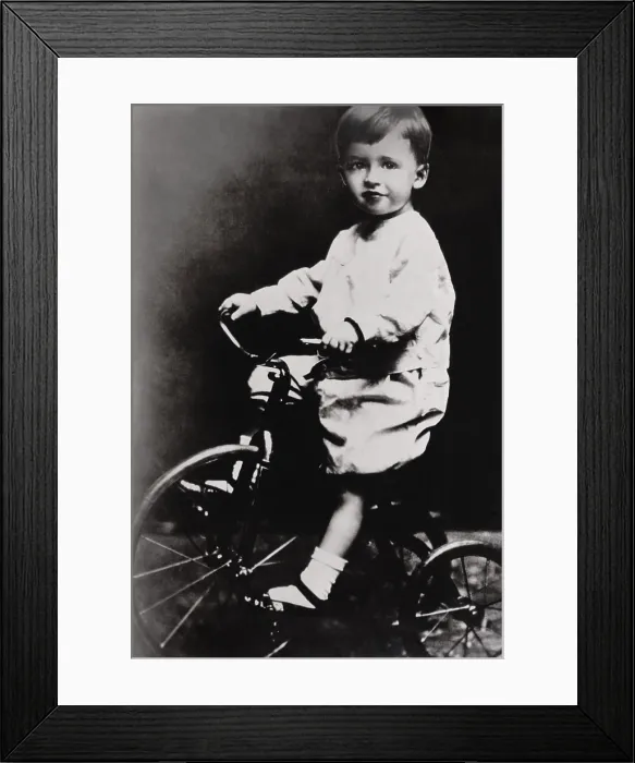 Framed Print : Humphrey Bogart belies his tough guy screen persona in a childhood photo on a tricycle, c. 1904 (BSLOC_2018_3_23) Framed Print : Humphrey Bogart belies his tough guy screen persona in a childhood photo on a tricycle, c. 1904 (BSLOC_2018_3_23)