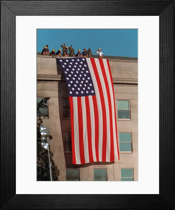 Framed Print : Firefighters hang a large American flag at the Pentagon, on the day following the Sept. 11, 2001 terrorist attack Framed Print : Firefighters hang a large American flag at the Pentagon, on the day following the Sept. 11, 2001 terrorist attack