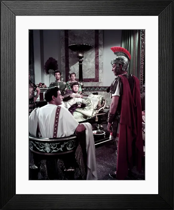 Framed Print : QUO VADIS, Leo Genn (back to camera), Peter Ustinov as Nero (reclining), Robert Taylor (right), 1951