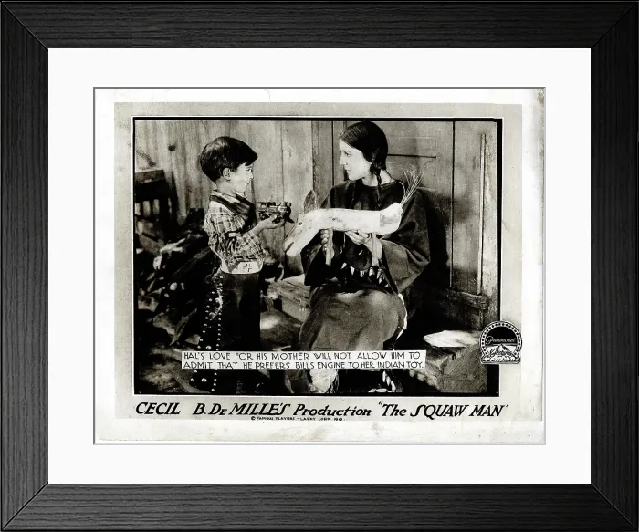 Framed Print : THE SQUAW MAN, l-r: Pat Moore, Ann Little on lobbycard, 1918