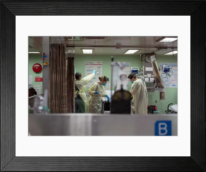 Framed Print : Navy hospital ship USNS Mercy sailors treat a patient from a Los Angeles medical facility, on March 29, 2020 Framed Print : Navy hospital ship USNS Mercy sailors treat a patient from a Los Angeles medical facility, on March 29, 2020