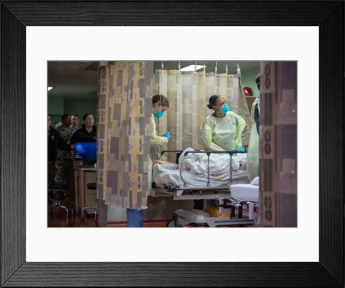 Framed Print : US sailors on the hospital ship USNS Mercy admit a patient in Los Angeles, March 29, 2020