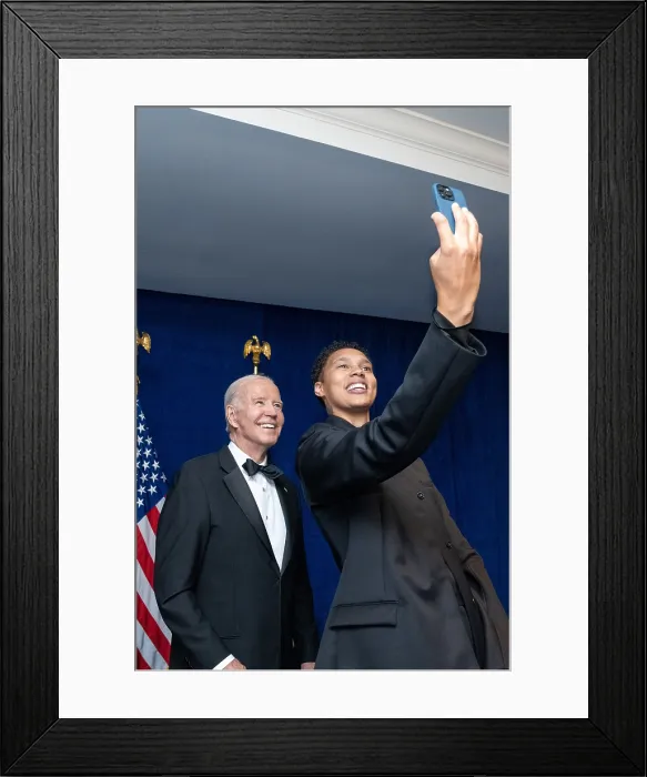 Framed Print : WNBA star Brittney Griner takes a selfie with President Joe Biden before the 2023 White House Correspondents Association dinner, April 29, 2023. (BSLOC_2023_6_85)