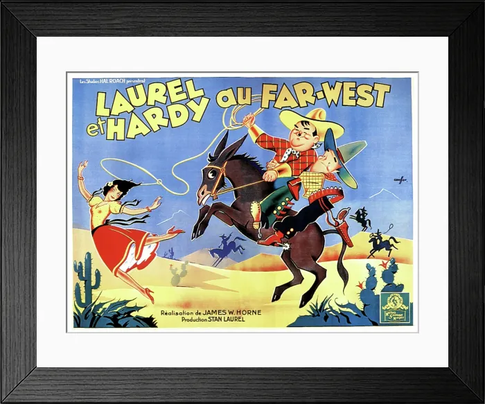 Framed Print : WAY OUT WEST, (aka LAUREL ET HARDY AU FAR-WEST), right: Oliver Hardy, Stan Laurel on French poster art, 1937