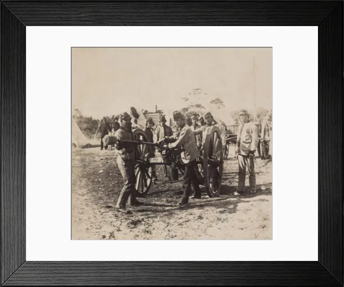 Framed Print : Confederate gunners of the Lafayette Artillery, cleaning a gun in one of the batteries on Coles Island, South Carolina, 1860-61. Photo by Osborn & Durbec (BSLOC_2019_2_91)