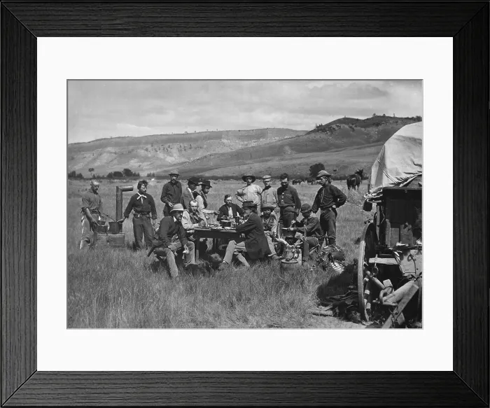 Framed Print : Noon meal in Ferdinand Hayden's camp of the US Geological Survey, August 24, 1870. Hayden sits at the far end of table in dark jacket