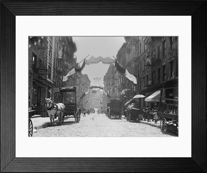 Framed Print : New York City's Mott Street decorated for an Italian religious festival, May 1908. Banners and lanterns arch over the street with children milling about (BSLOC_2018_1_74) Framed Print : New York City's Mott Street decorated for an Italian religious festival, May 1908. Banners and lanterns arch over the street with children milling about (BSLOC_2018_1_74)