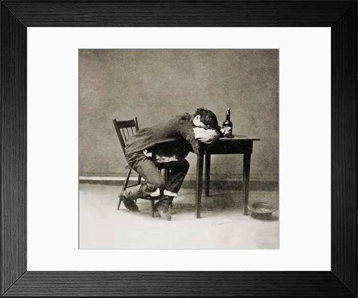 Framed Print : Drunk man with his head on table, 1874. He is cleaned out and at the sad end of the drinker's progress (BSLOC_2018_2_113)