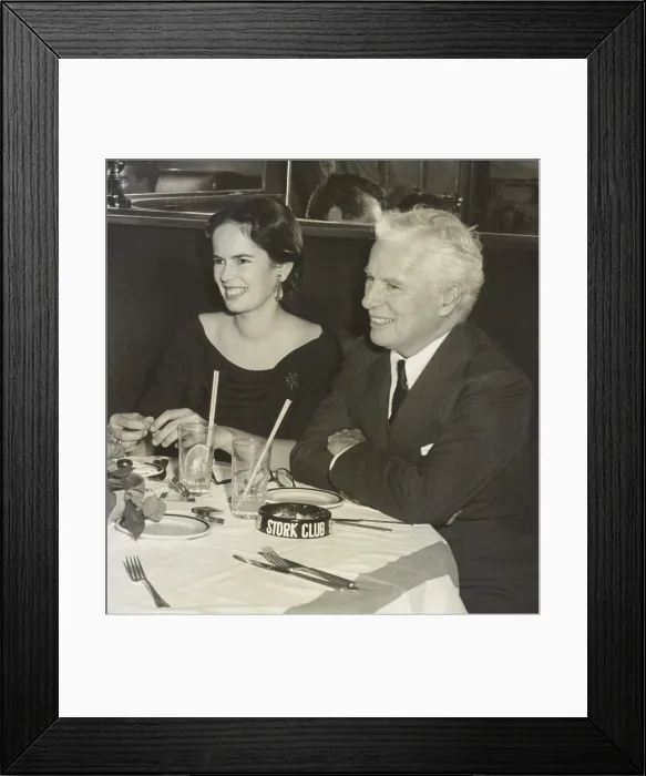 Framed Print : Charlie Chaplin and wife Oona O'Neill dining at the Stork Club, New York City, Sept. 15, 1952 Framed Print : Charlie Chaplin and wife Oona O'Neill dining at the Stork Club, New York City, Sept. 15, 1952